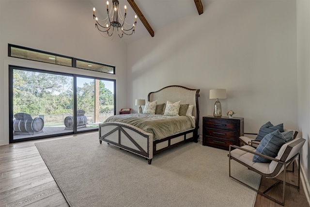 bedroom with beamed ceiling, high vaulted ceiling, a notable chandelier, light hardwood / wood-style floors, and access to outside