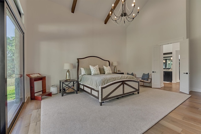 bedroom with access to exterior, light wood-type flooring, high vaulted ceiling, and beamed ceiling