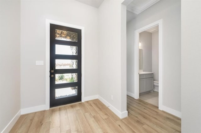 entryway with light hardwood / wood-style floors