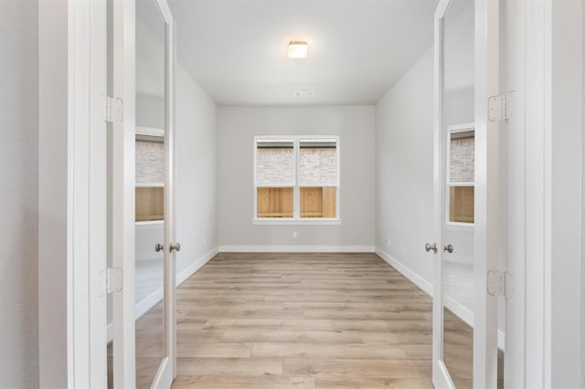 unfurnished room featuring light hardwood / wood-style floors