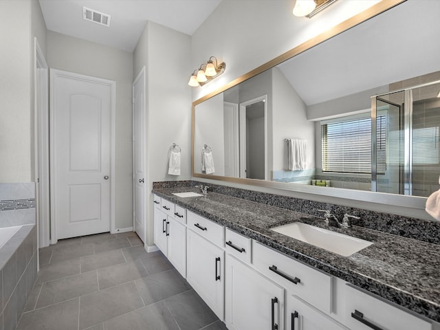 bathroom featuring vanity, tile patterned floors, and independent shower and bath