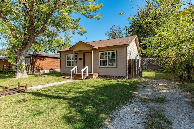 bungalow with a front lawn