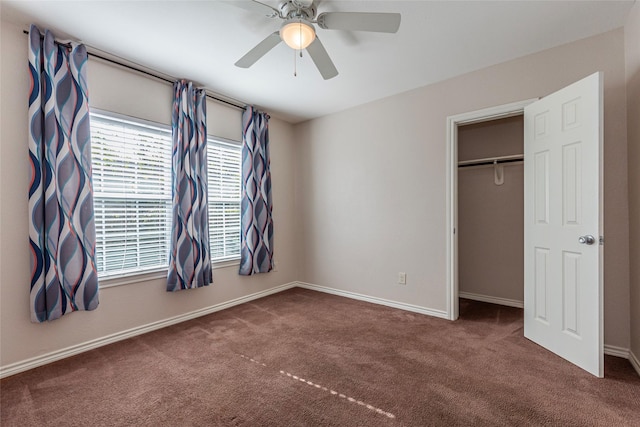 unfurnished bedroom featuring carpet flooring, ceiling fan, and a closet