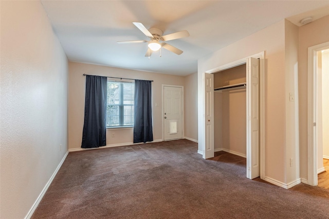 unfurnished bedroom featuring a closet, dark carpet, and ceiling fan