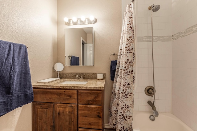 bathroom with shower / tub combo with curtain and vanity