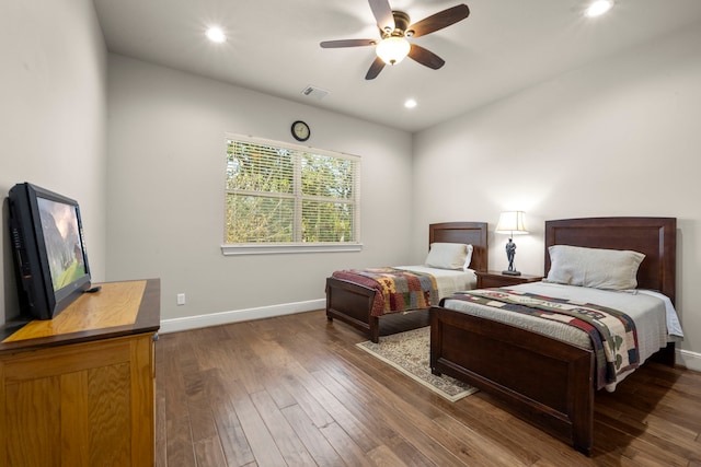 bedroom with recessed lighting, visible vents, baseboards, and wood finished floors