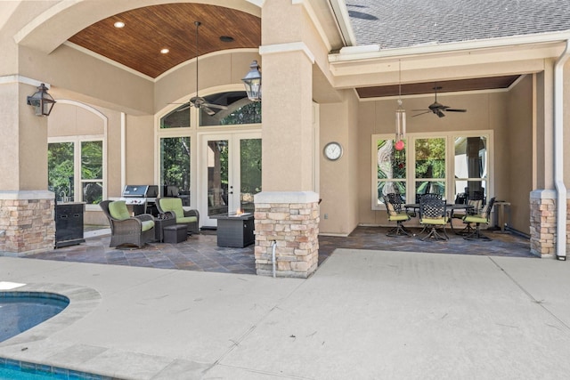 view of patio with ceiling fan, a grill, and french doors