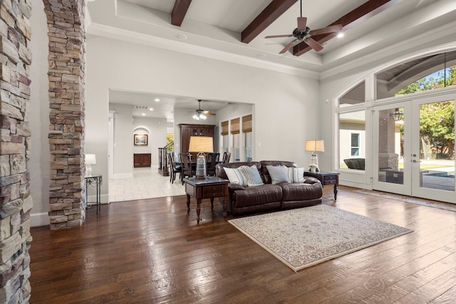 living area with wood-type flooring, a healthy amount of sunlight, and french doors