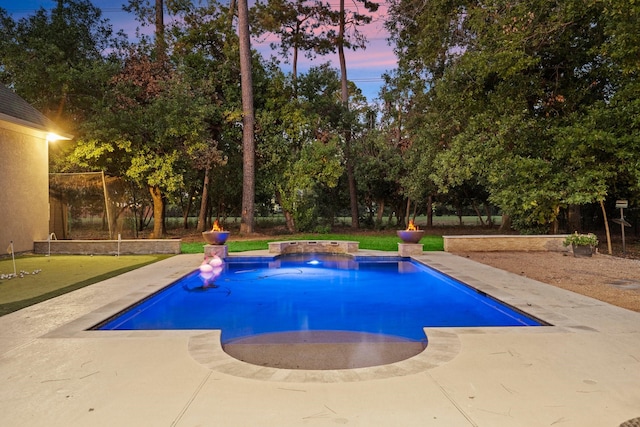 pool with a patio area and a fenced backyard