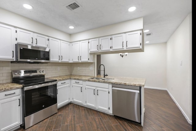 kitchen with white cabinetry, appliances with stainless steel finishes, and sink