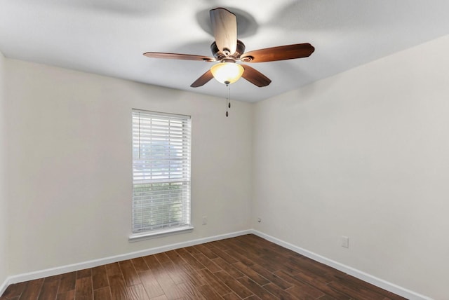 spare room featuring ceiling fan and dark hardwood / wood-style flooring