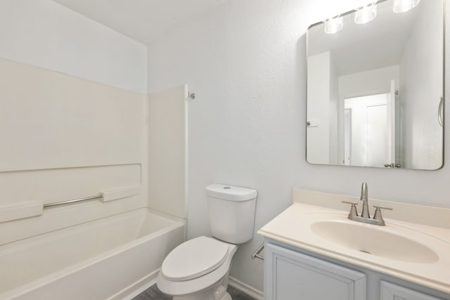 full bathroom with vanity,  shower combination, and toilet