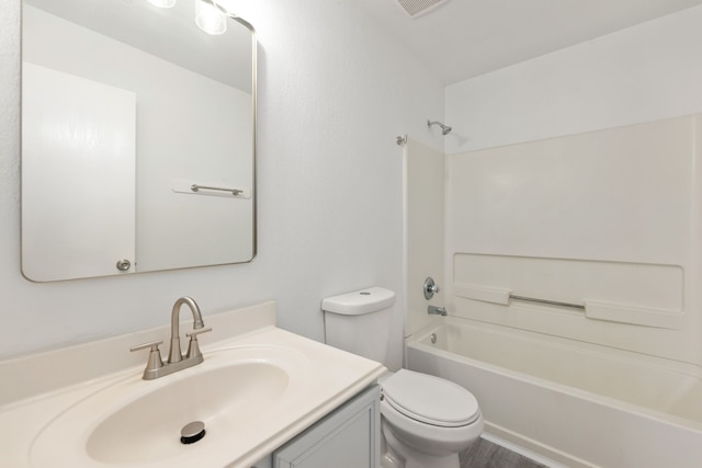 full bathroom featuring vanity,  shower combination, and toilet