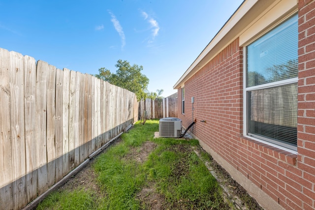 view of yard featuring central AC unit