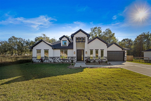 view of front of home featuring a front lawn and a garage