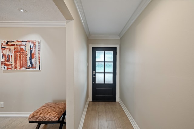 doorway to outside featuring ornamental molding and light hardwood / wood-style flooring