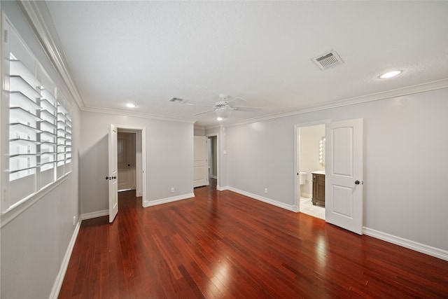 empty room featuring dark hardwood / wood-style flooring, ceiling fan, and ornamental molding