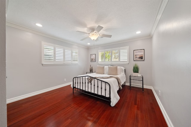 bedroom featuring ceiling fan, dark hardwood / wood-style flooring, crown molding, and a textured ceiling