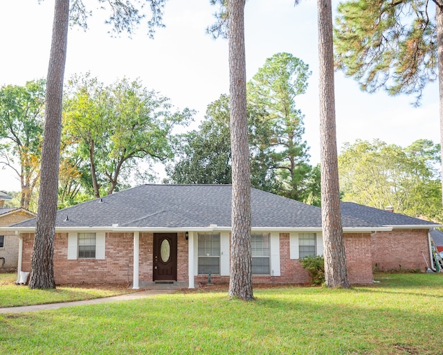 ranch-style home with a front lawn