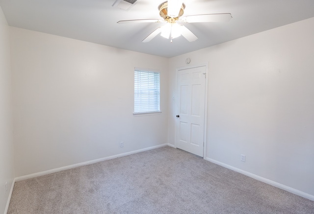 unfurnished room with light carpet and ceiling fan