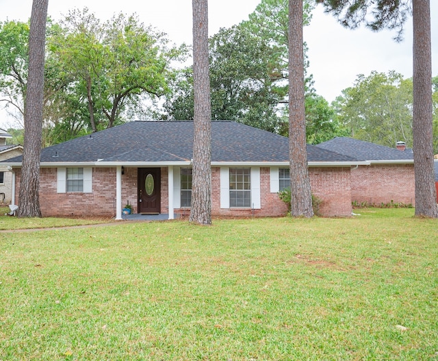 ranch-style home with a front lawn