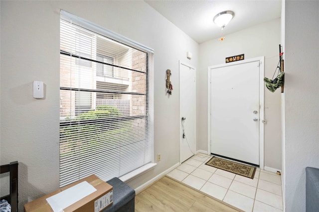 foyer with light tile patterned floors