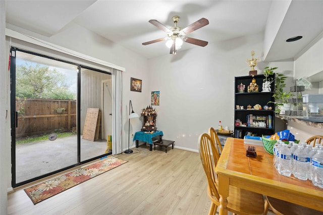 dining room with light wood-type flooring and ceiling fan