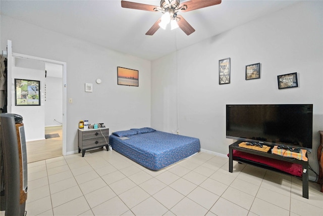 tiled bedroom with ceiling fan