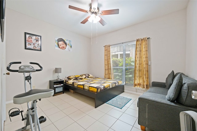 bedroom with ceiling fan and light tile patterned flooring