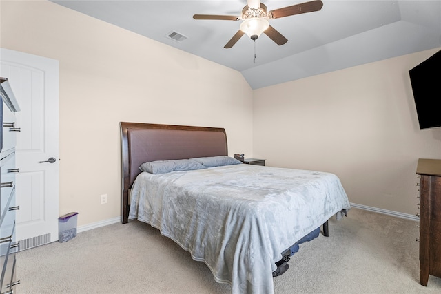 bedroom with light carpet, ceiling fan, and vaulted ceiling