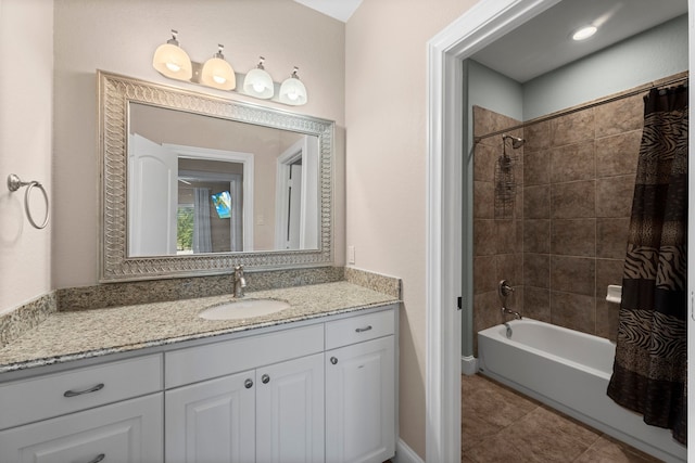 bathroom featuring vanity, shower / bath combo, and tile patterned flooring