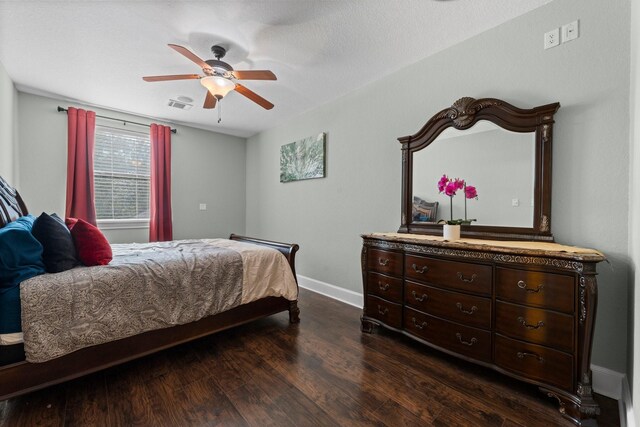 bedroom with ceiling fan and dark hardwood / wood-style flooring