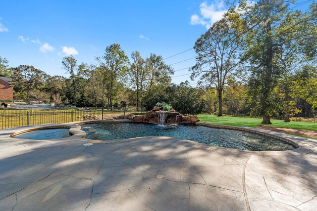 view of pool featuring a patio area, a lawn, and pool water feature