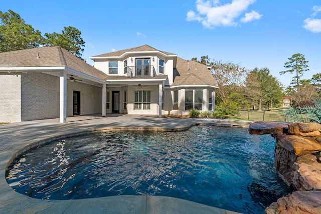 view of pool featuring ceiling fan and a patio