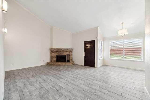 unfurnished living room featuring light hardwood / wood-style floors, ornamental molding, and a brick fireplace