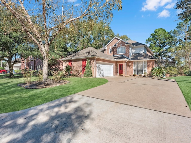 view of front facade with a garage and a front lawn