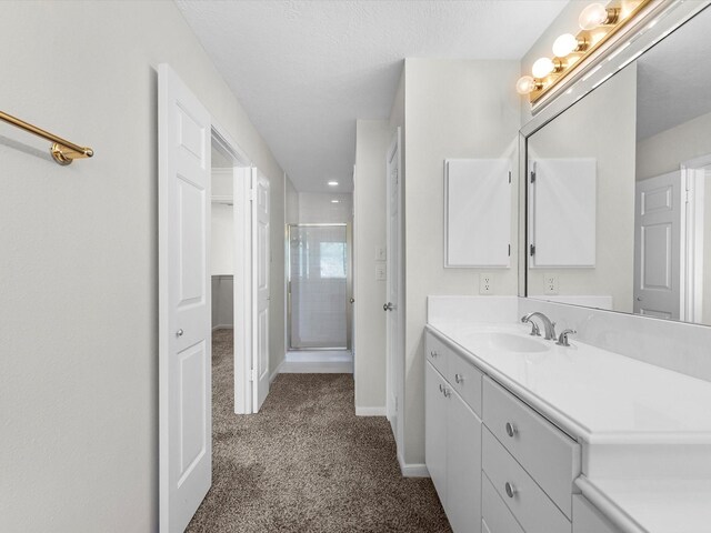 8311 Vaulted Pine Dr, Humble, TX 77346 - full bathroom featuring a stall shower, vanity, and baseboards