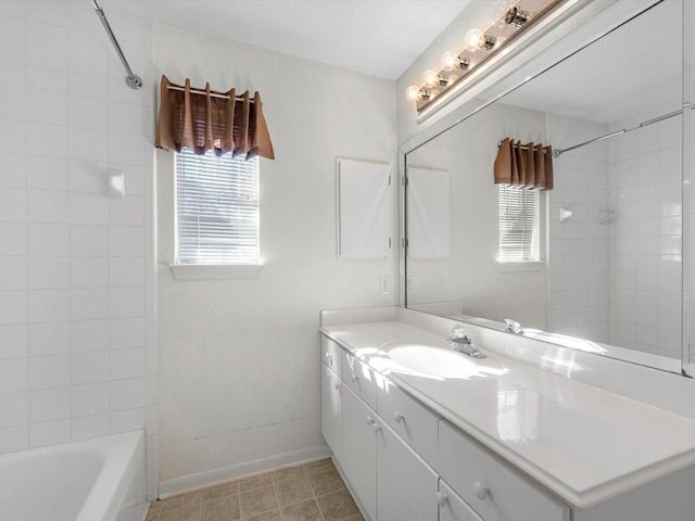 8311 Vaulted Pine Dr, Humble, TX 77346 - bathroom featuring vanity, baseboards, and bathtub / shower combination