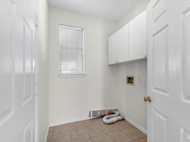 8311 Vaulted Pine Dr, Humble, TX 77346 - washroom featuring hookup for a washing machine, cabinet space, baseboards, and light tile patterned floors