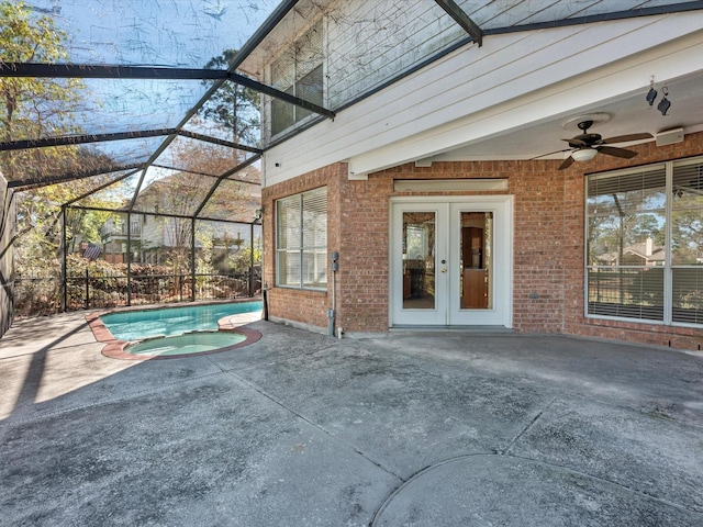 8311 Vaulted Pine Dr, Humble, TX 77346 - view of patio with french doors, a ceiling fan, an in-ground hot tub, and glass enclosure