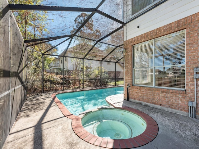 8311 Vaulted Pine Dr, Humble, TX 77346 - view of swimming pool with a pool with connected hot tub, a patio area, and a lanai