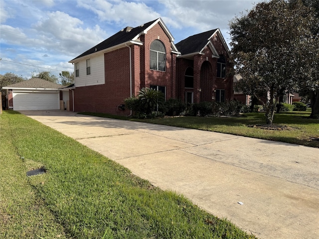 view of front property featuring a front yard and a garage