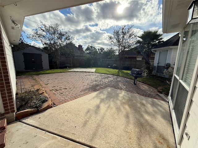 view of patio with a storage shed