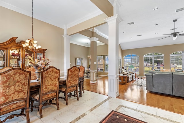 dining area featuring ceiling fan with notable chandelier, light wood-type flooring, crown molding, and ornate columns