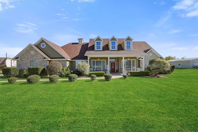 cape cod home with a porch and a front yard