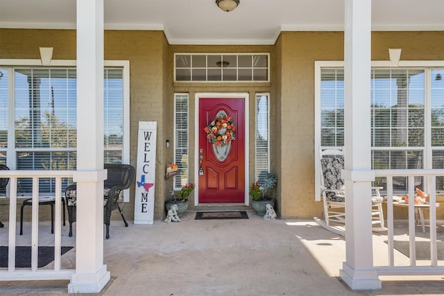 entrance to property with a porch