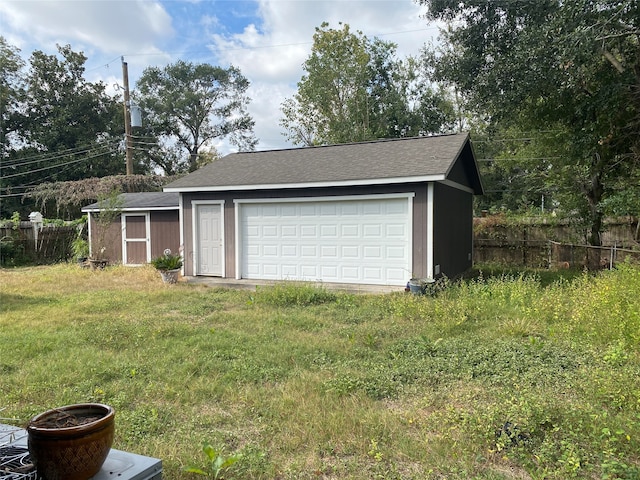 garage with a yard