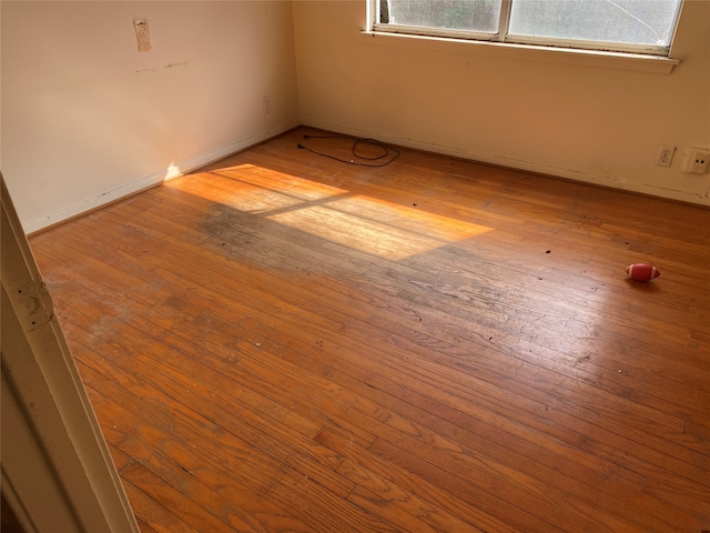 unfurnished room featuring light hardwood / wood-style floors