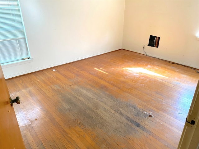 empty room with wood-type flooring