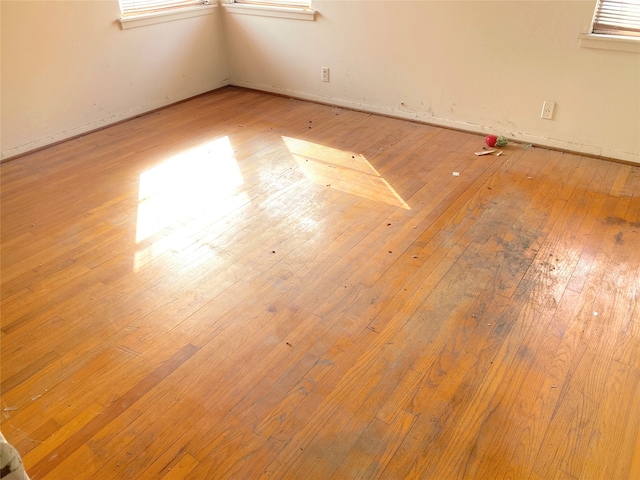 unfurnished room with light wood-type flooring